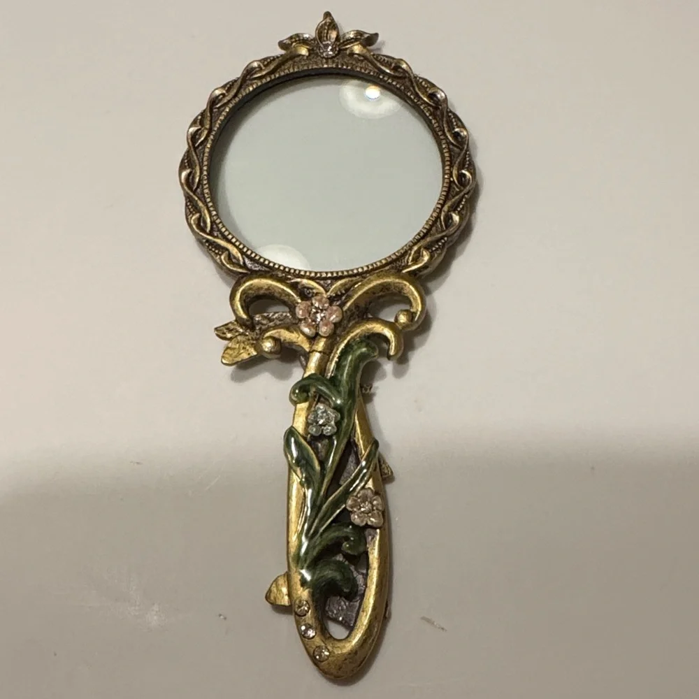 Vintage Handheld Magnifier glass with two intricate Floral Designs
